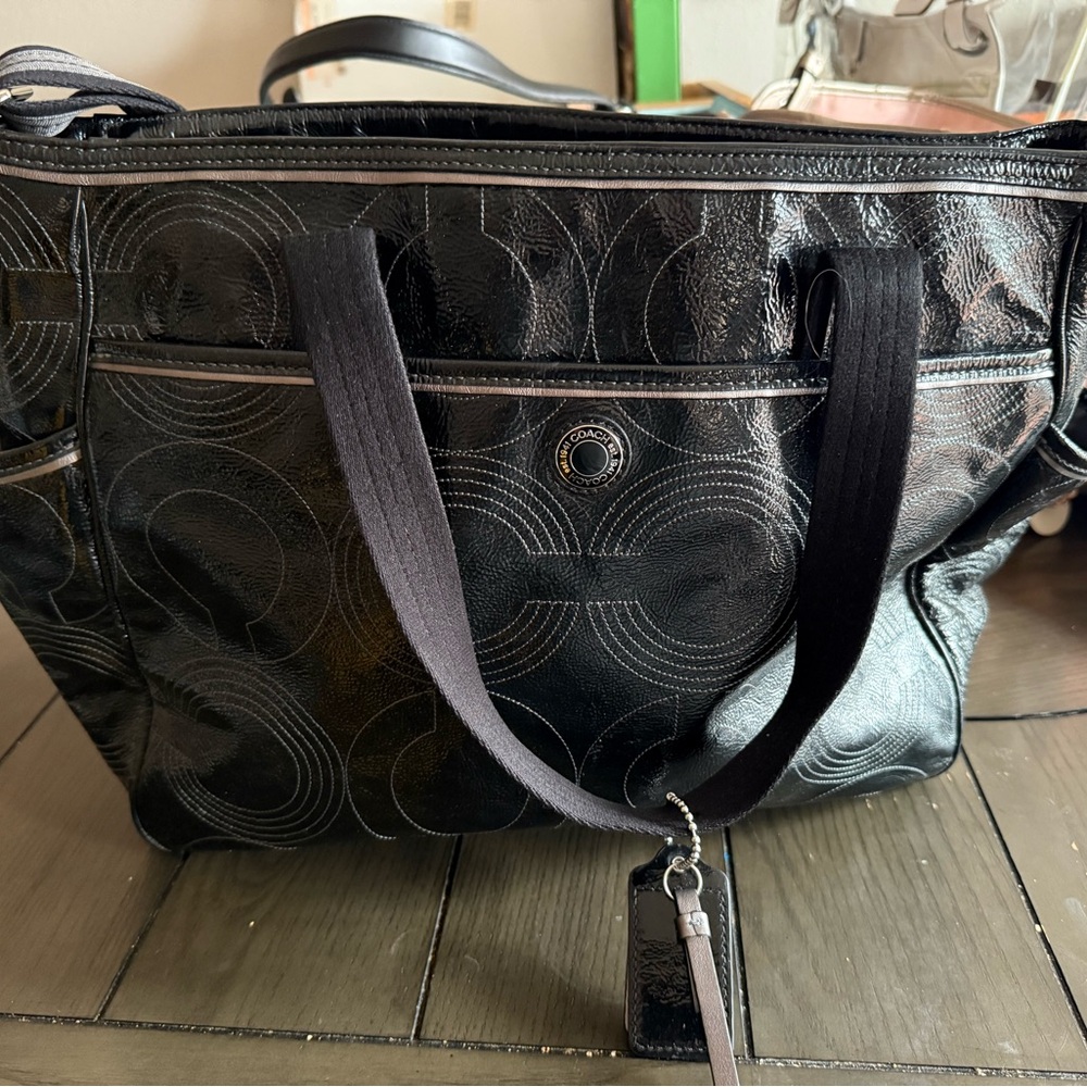 Coach Black Baby Bag with Versatile Carrying Options